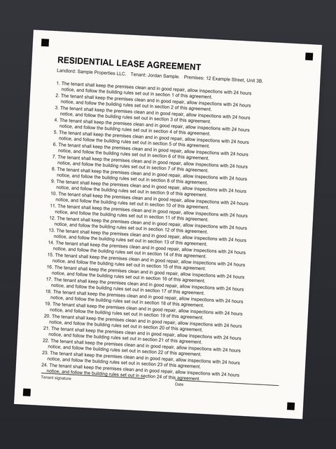 Before: Lease agreement on a dark table, tilted 3°.