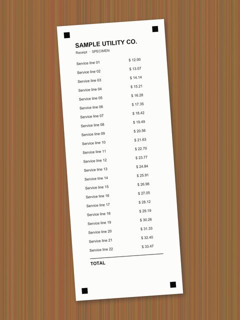 Before: Narrow utility receipt on wood, tilted 4°.